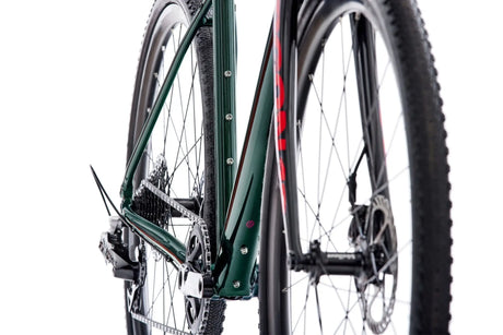 Rear angle of Argon 18 Grey Matter Apex XPLR Gravel Bike showing drivetrain and frame mounts, ideal for bikepacking and off-road adventures.