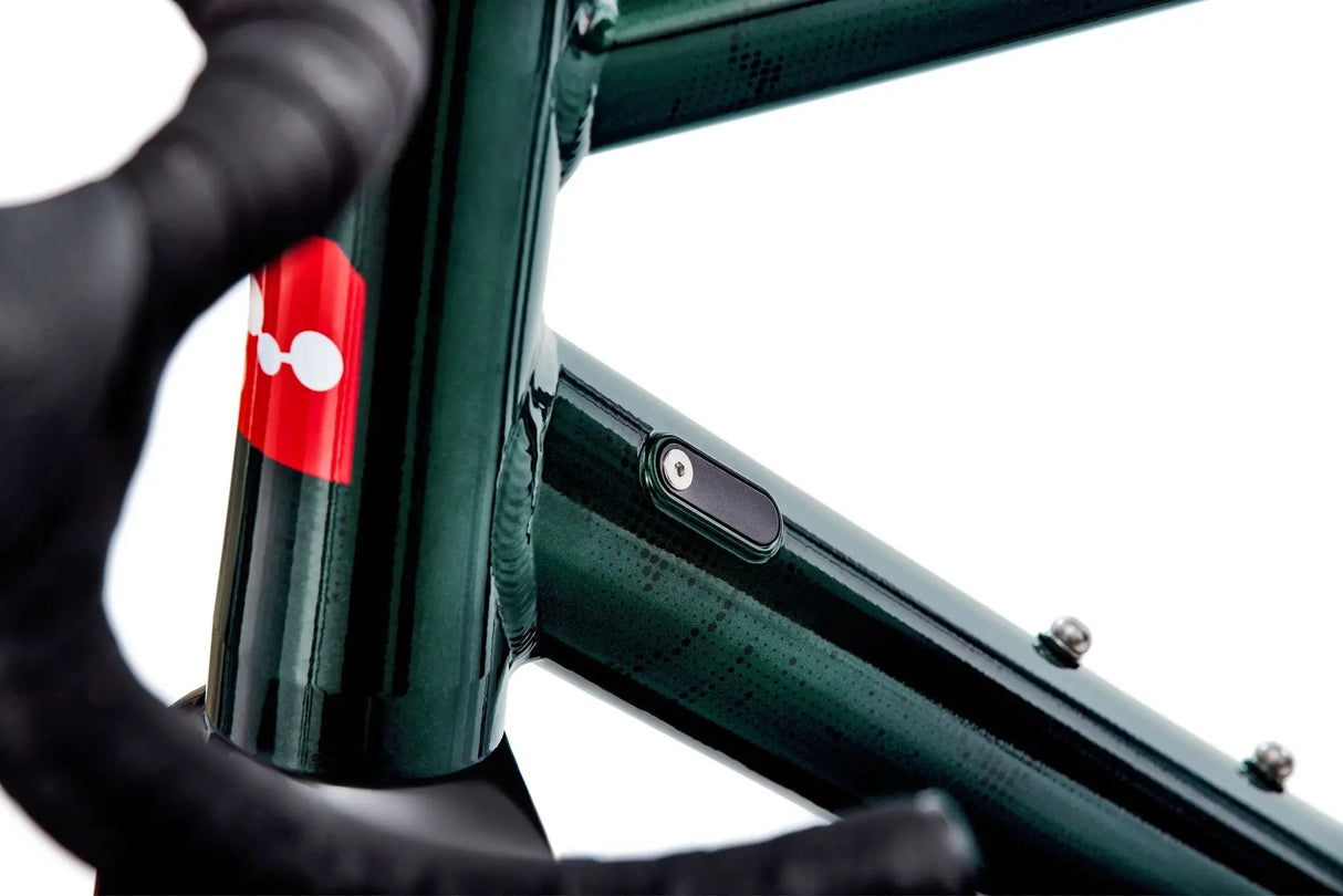 Close-up of Argon 18 Grey Matter Apex XPLR Gravel Bike frame detail, showing internal cable routing and premium paint finish for durability.