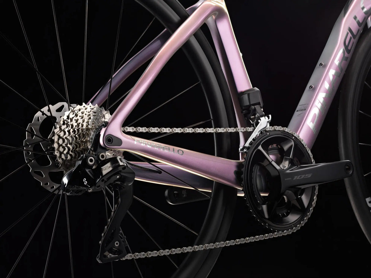 Close-up of a bicycle's chain and gear system on a black background