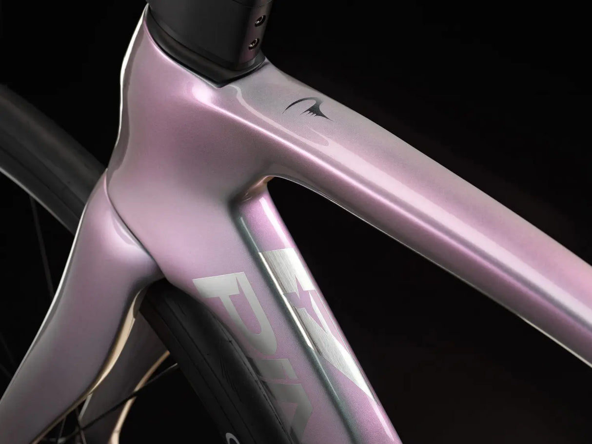 Close-up of a pink bicycle frame with 'Fulcrum' branding on a black background