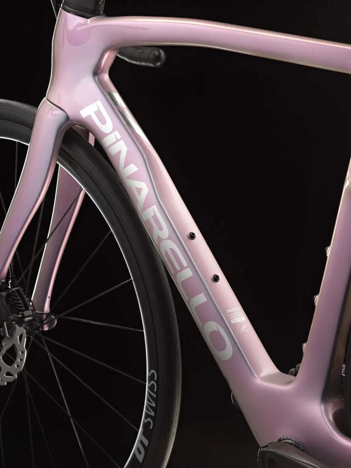 Pink Pinarello bicycle frame on a black background