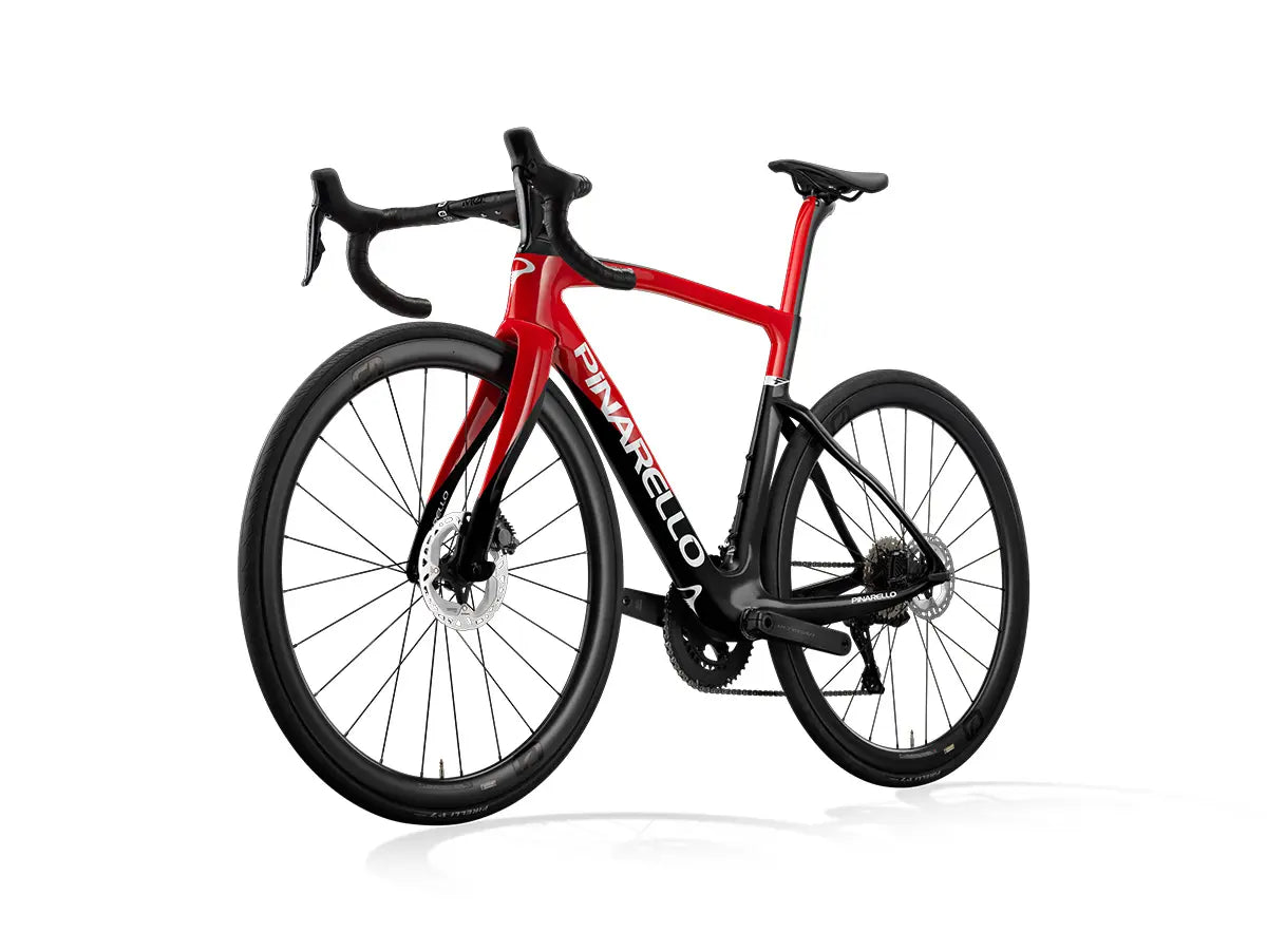 Front angled view of the Pinarello F7 Ultegra Di2 road bike in red and black, highlighting its aerodynamic frame and integrated handlebars.