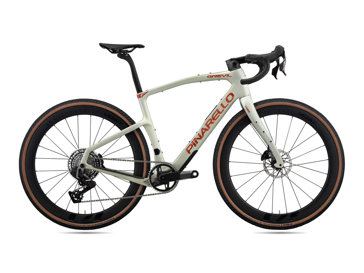 Moab Amber Pinarello Grevil F7 gravel bike, drive-side profile with SRAM Force XPLR AXS and MOST carbon wheels.