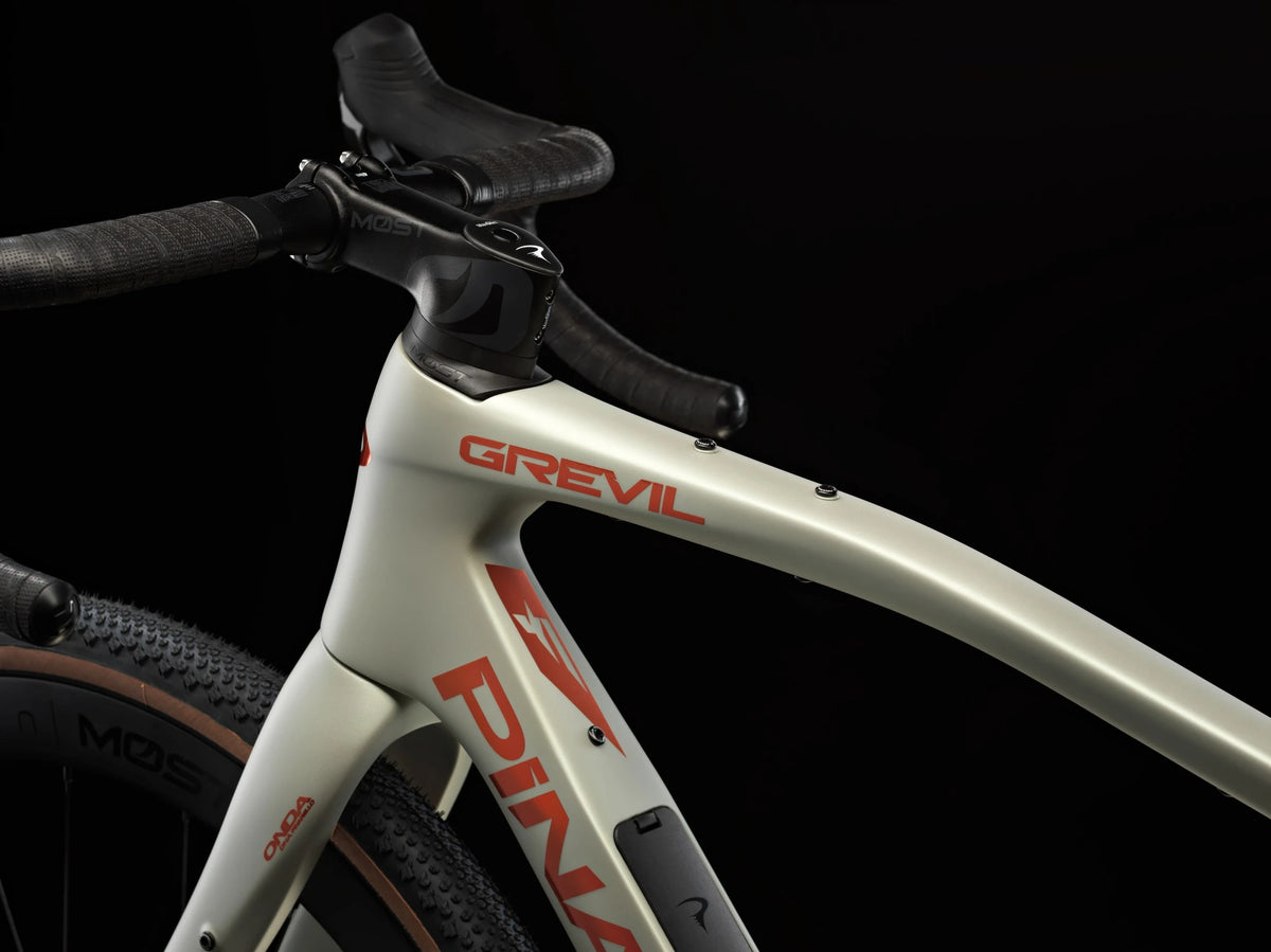 Top tube of the Moab Amber Pinarello Grevil F7 with the Grevil logo, stem and handlebar.