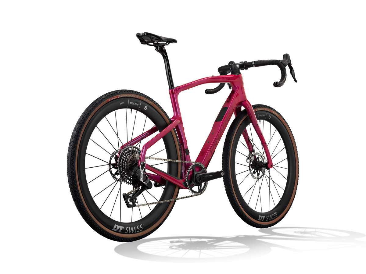 Lunar Bloom Pinarello Grevil F9 gravel bike from a rear three-quarter angle showing the rear derailleur and cassette.