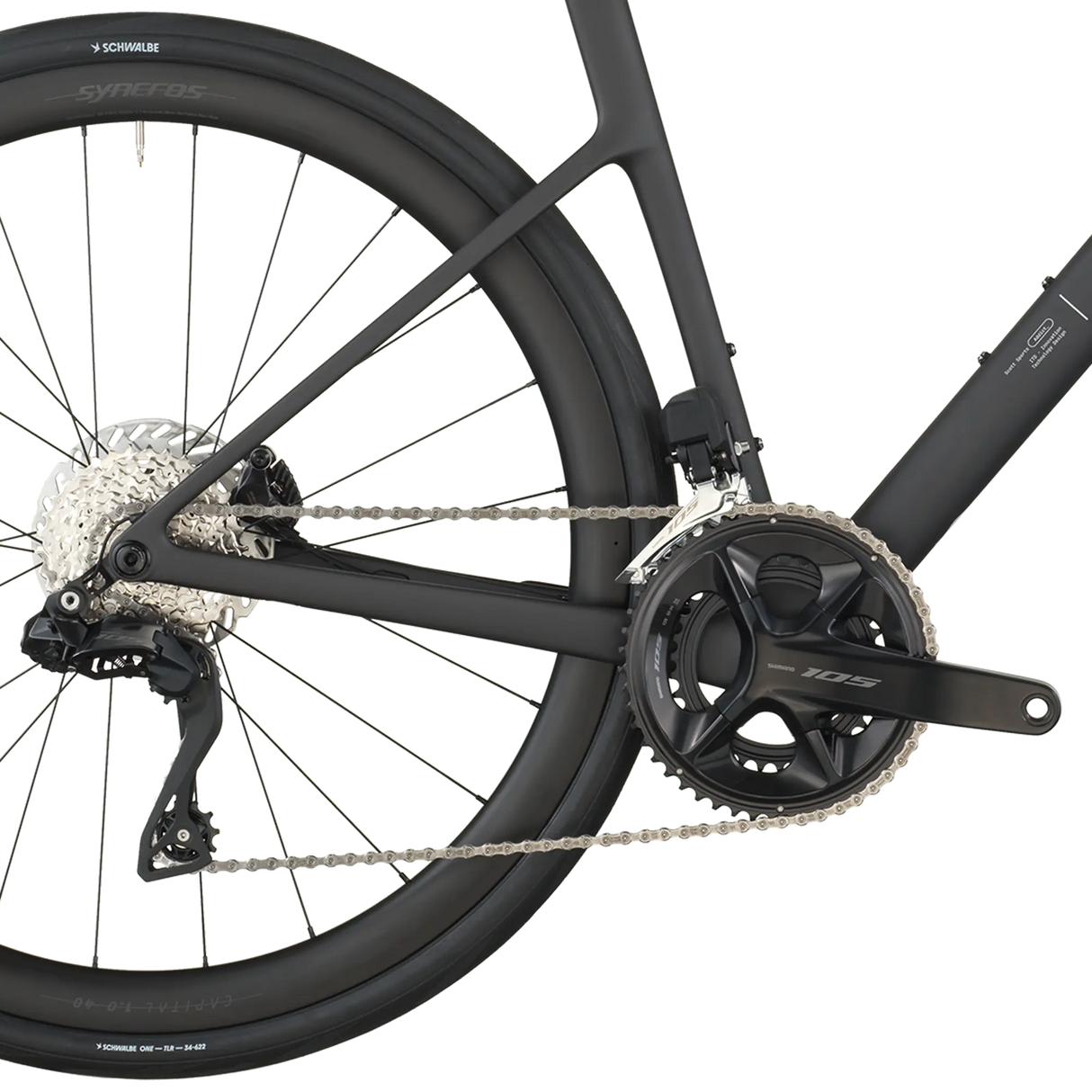 Close-up of a bicycle's rear wheel and gear system on a white background