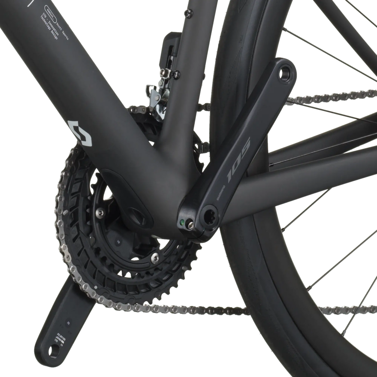 Close-up of a bicycle chain and gear system on a white background