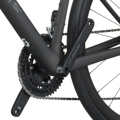 Close-up of a bicycle chain and gear system on a white background