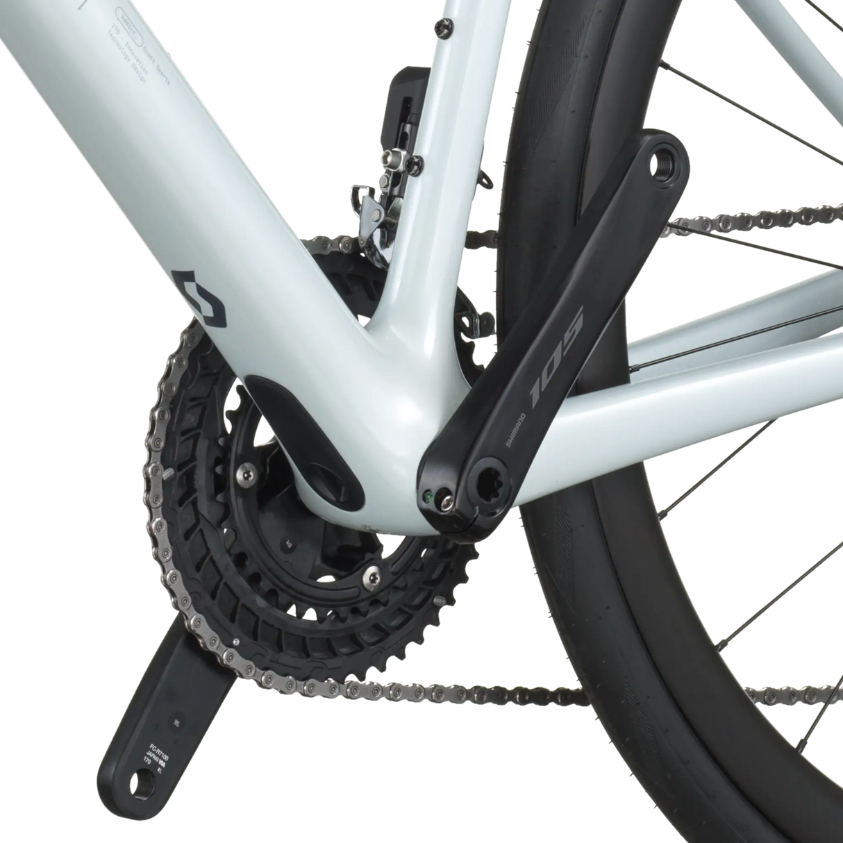 Close-up of a bicycle chain and gear system on a white background