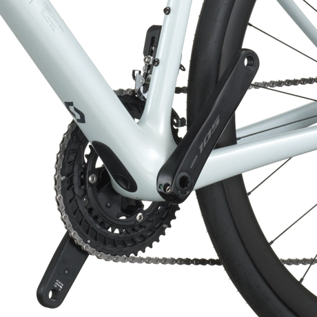Close-up of a bicycle chain and gear system on a white background