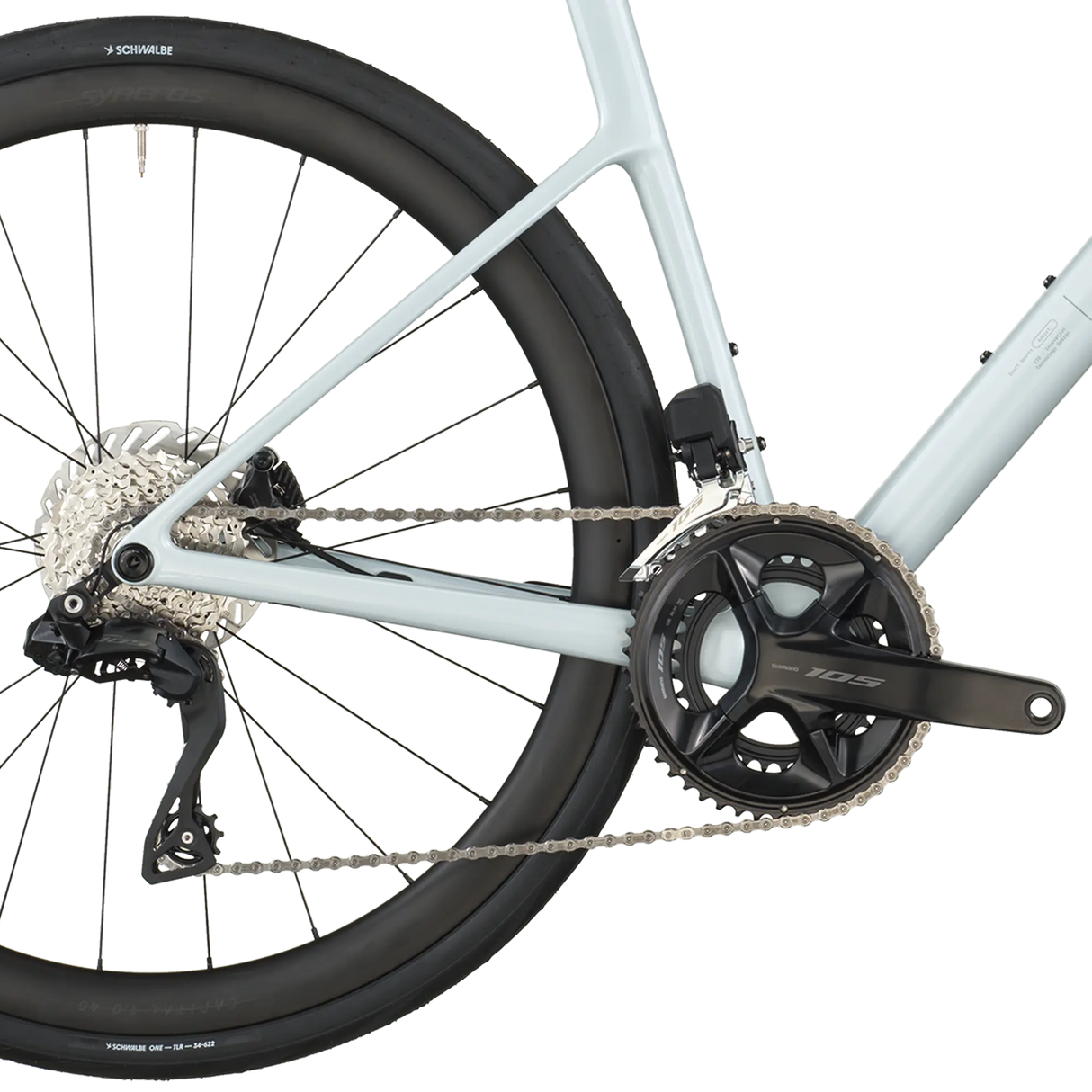 Close-up of a bicycle chain and gear system on a white background