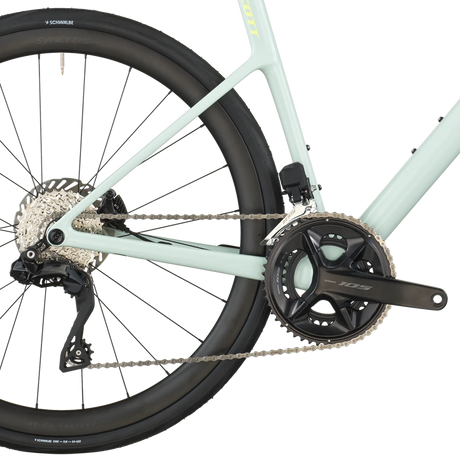 Close-up of a bicycle's rear wheel and gear system on a white background
