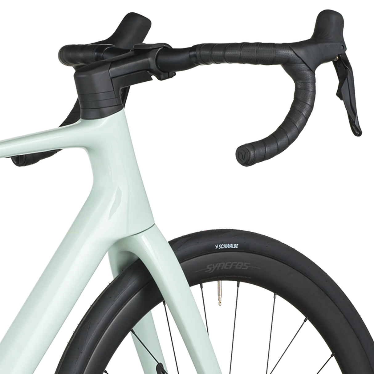 Light blue bicycle with black handlebars and tires on a white background