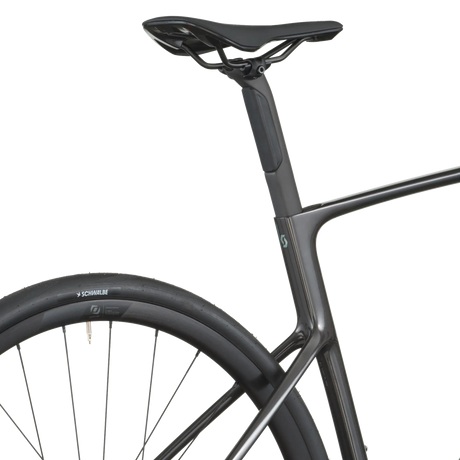 Close-up of a bicycle frame and wheel on a white background