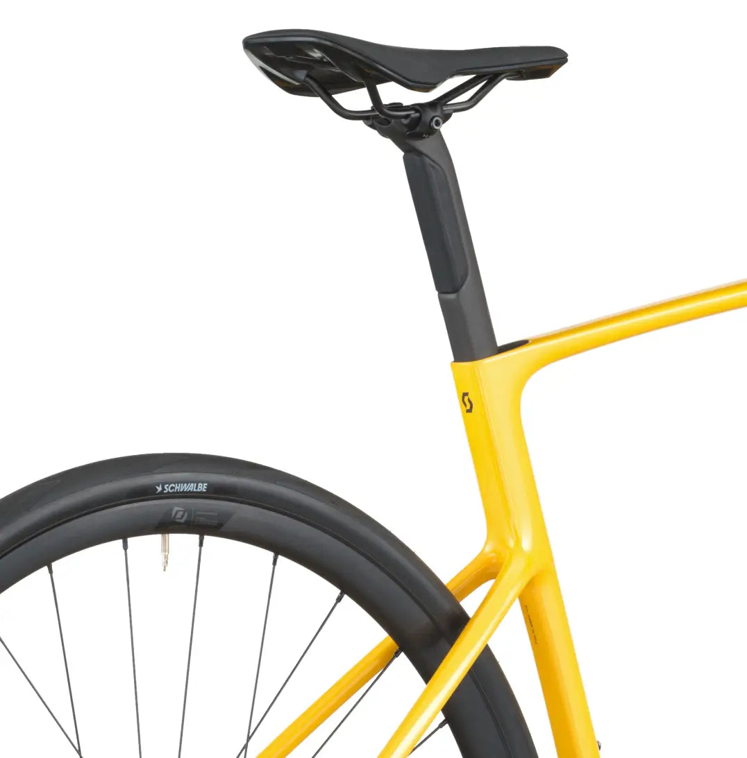 Yellow bicycle frame with black seat and tire on a white background