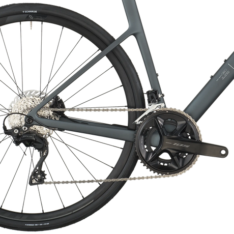 Close-up of a bicycle's rear wheel and gear system on a white background