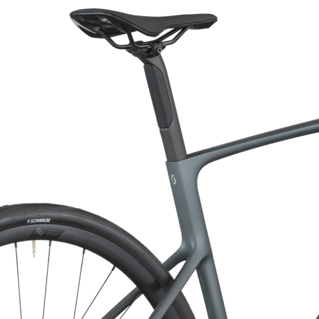 Gray bicycle frame with a black seat on a white background
