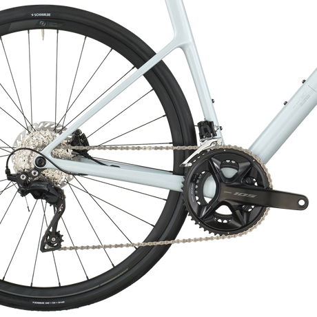 Close-up of a bicycle's rear wheel and gear system on a white background