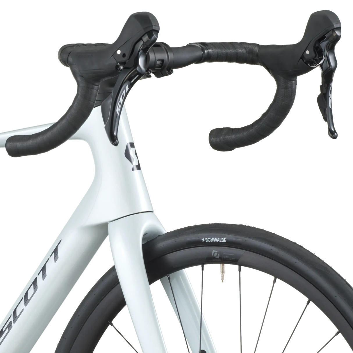 Close-up of a white bicycle with black handlebars on a white background