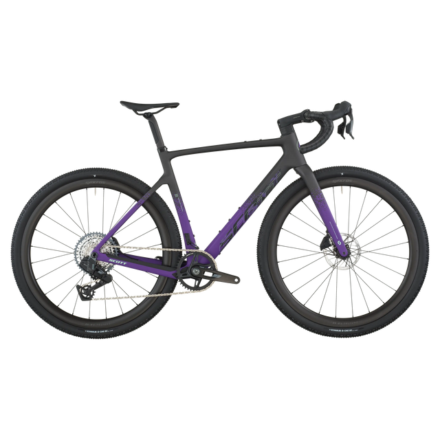 Close-up of a bicycle with a purple frame and black components on a white background