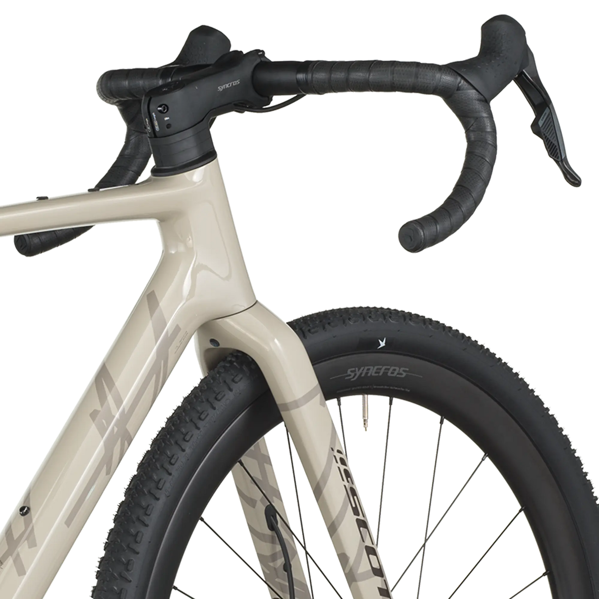 Close-up of a bicycle with beige frame and black tires on a white background