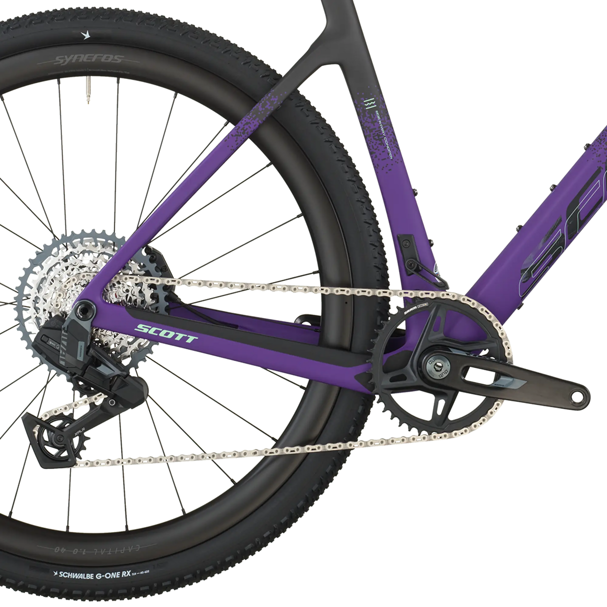 Close-up of a purple bicycle with visible brand logos on a white background