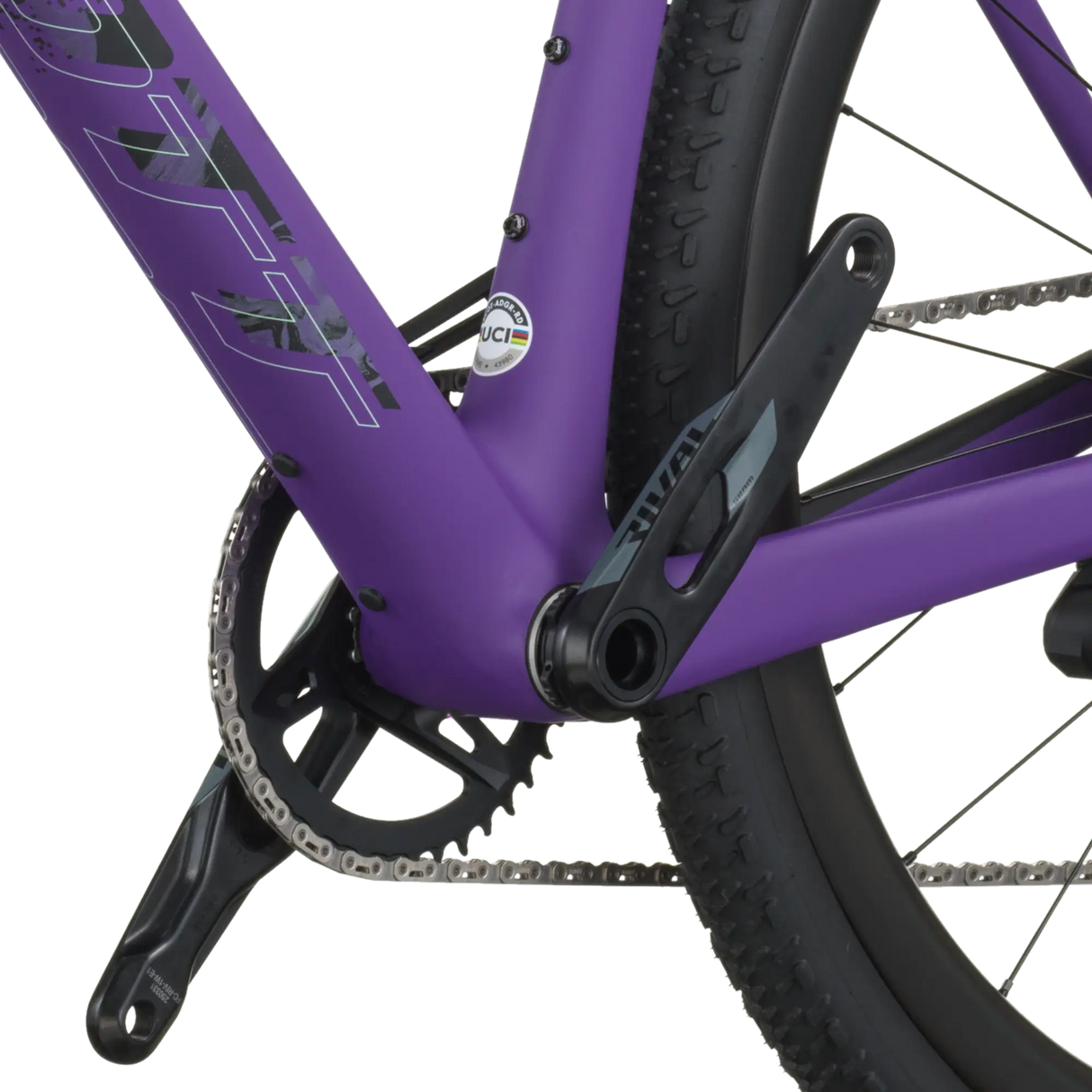 Close-up of a purple bicycle frame with chain and wheel on a white background