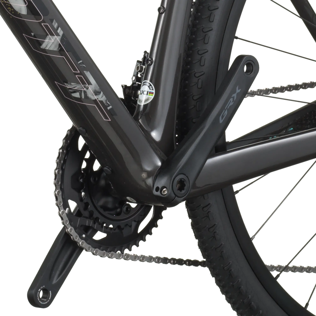 Close-up of a bicycle chain and gear system on a white background