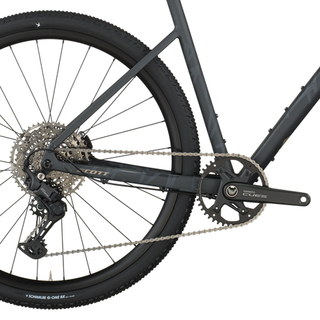 Close-up of a bicycle's rear wheel and gear system on a white background