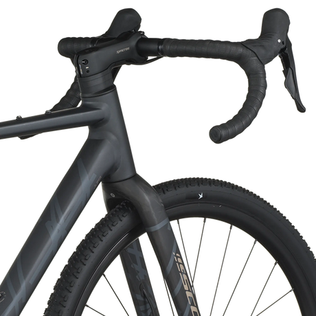 Close-up of a black bicycle with visible branding on a white background