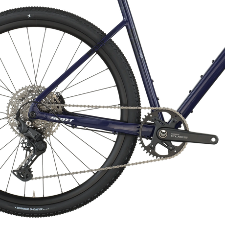Close-up of a bicycle chain and gear system on a white background