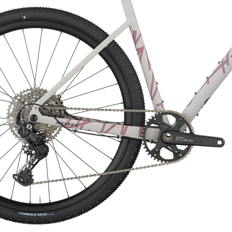 Close-up of a bicycle chain and gear system on a white background