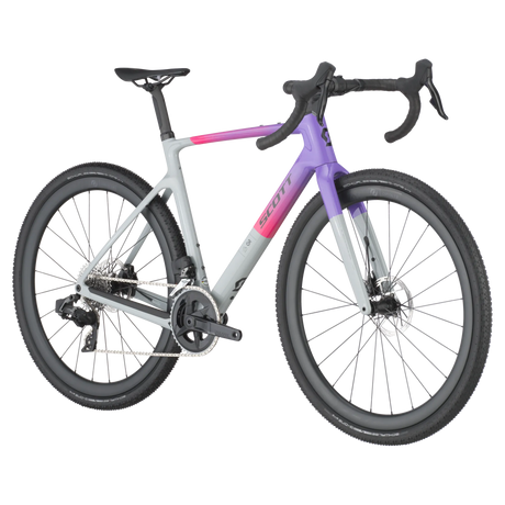 Side angle of Scott Addict Gravel 20 Carbon Gravel Bike in gray, purple, and pink, built for endurance and performance on gravel terrain.