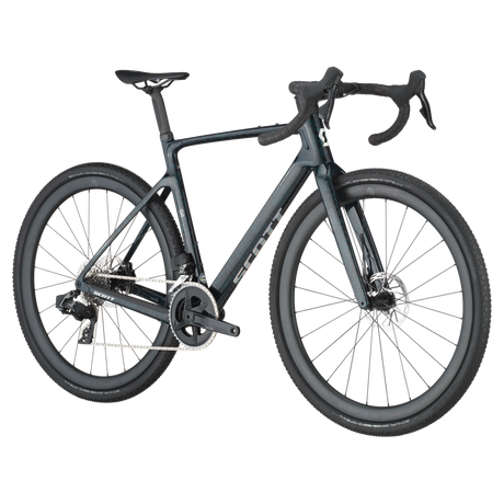 Angled view of Scott Addict Gravel 20 Carbon Gravel Bike in dark green, showcasing aerodynamic frame and disc brakes for gravel riding.