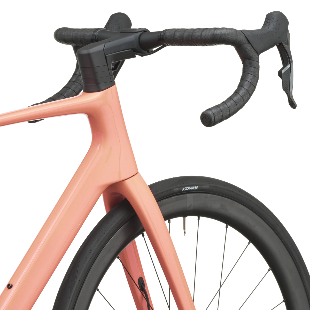 Peach pink Scott Addict 25 road bike from a front three-quarter angle with the SCOTT logo on the down tube.