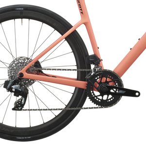 SRAM Rival AXS rear derailleur and cassette on the peach pink Scott Addict 25, with Fulcrum Wind 42 carbon wheel.