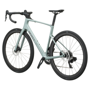 Iron grey Scott Addict 25 road bike from the non-drive side, showing the dropped seat stays and disc rotors.