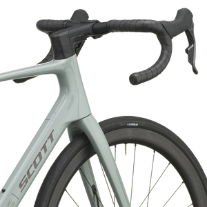 Iron grey Scott Addict 25 road bike from a front three-quarter angle with the SCOTT logo on the down tube.