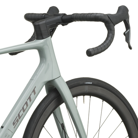 Iron grey Scott Addict 25 road bike from a front three-quarter angle with the SCOTT logo on the down tube.