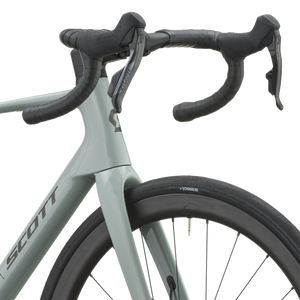 Cockpit of the iron grey Scott Addict 25 with taped drop bars and SRAM Rival AXS shifters.
