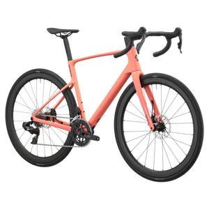 Peach pink Scott Addict 25 road bike, drive-side profile with SRAM Rival AXS groupset and disc brakes.