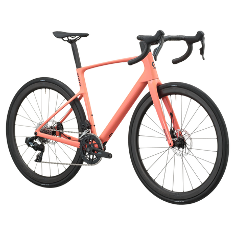 Peach pink Scott Addict 25 road bike, drive-side profile with SRAM Rival AXS groupset and disc brakes.
