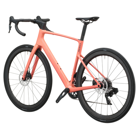 Peach pink Scott Addict 25 road bike from the non-drive side, showing the dropped seat stays and disc rotors.
