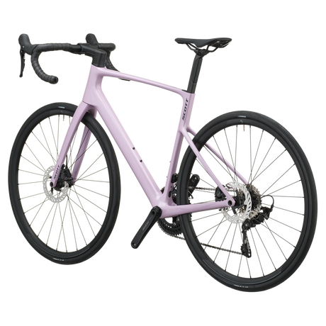 Mallow pink Scott Addict 50 road bike from the non-drive side, showing the dropped seat stays and disc rotors.