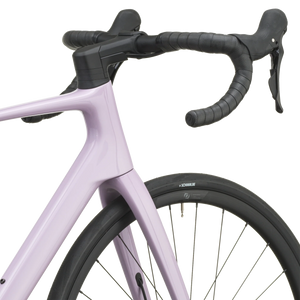 Mallow pink Scott Addict 50 road bike from a front three-quarter angle with the SCOTT logo on the down tube.