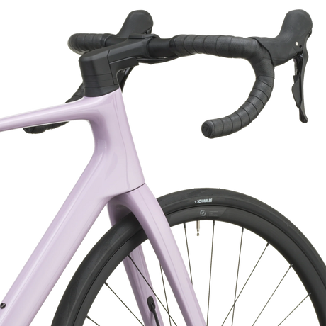 Mallow pink Scott Addict 50 road bike from a front three-quarter angle with the SCOTT logo on the down tube.