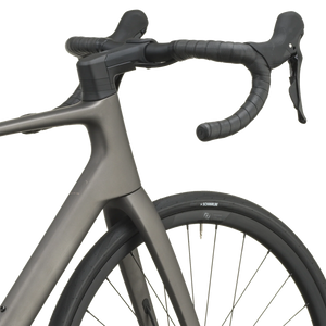 Tungsten grey Scott Addict 50 road bike from a front three-quarter angle with the SCOTT logo on the down tube.
