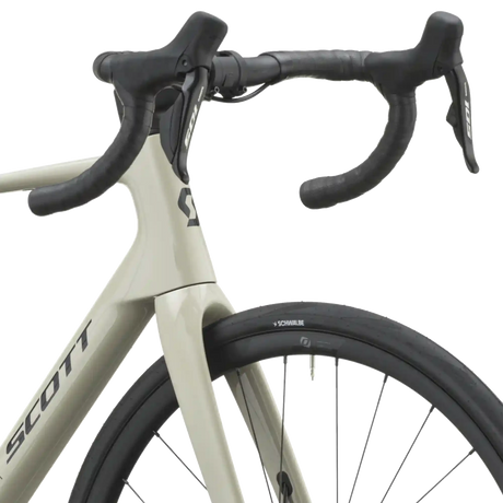 Cockpit of the agate grey Scott Addict 40 with taped drop bars and Shimano 105 shifters.