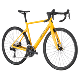 Side-angle view of the Scott Addict 40 Road Bike in yellow, showcasing its sleek design, carbon frame, and high-performance Shimano drivetrain.