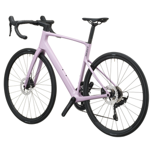 Mallow pink Scott Addict 50 road bike from the non-drive side, showing the dropped seat stays and disc rotors.